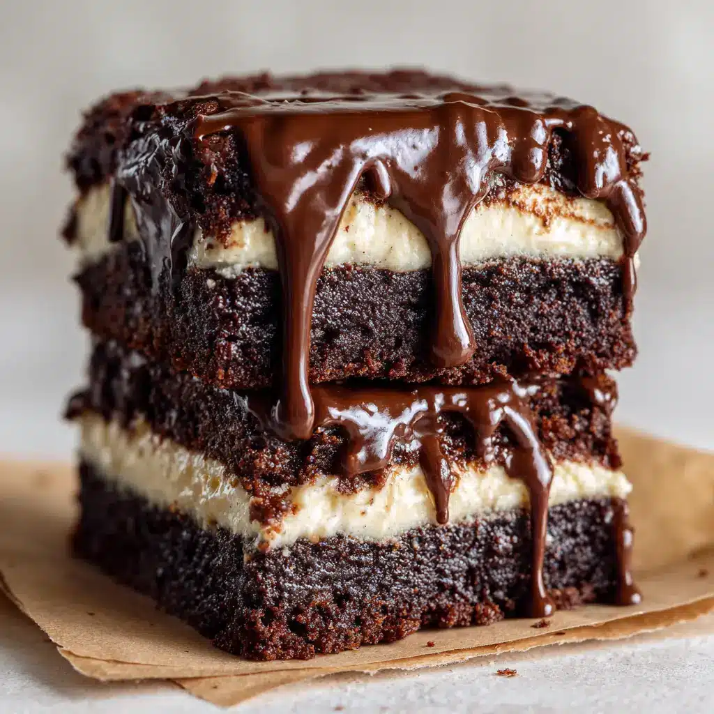 Baileys Buttercream Brownies: The Ultimate Fudgy Recipe 2 A close-up shot of two fudgy chocolate brownies with Baileys buttercream stacked on a white plate, showing the dense and moist texture of the brownie.