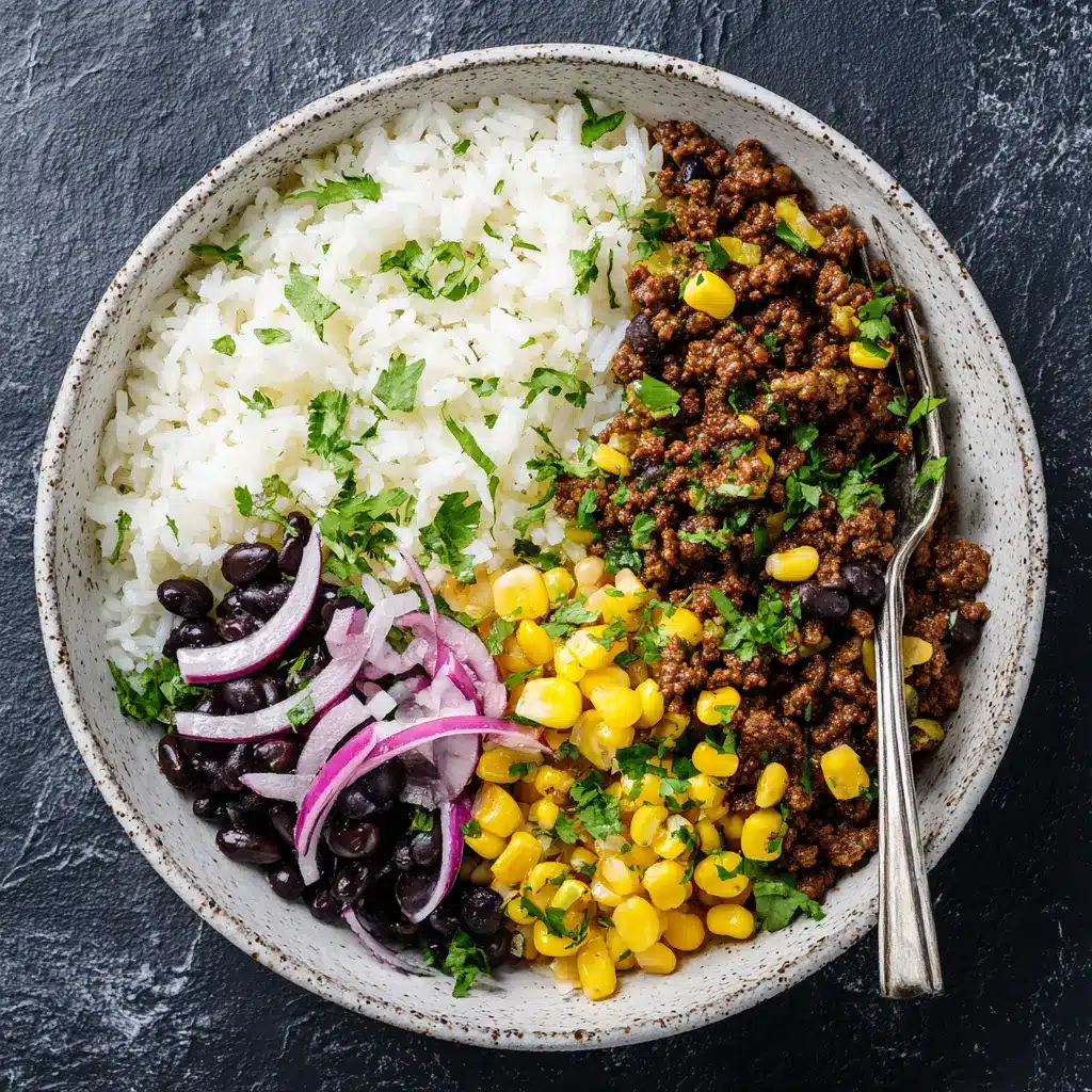 High-Protein Beef Rice Bowl (Quick & Healthy Recipe) 2 A top-down view of a savory ground beef and rice bowl, showcasing the vibrant colors of the bell peppers and broccoli. A perfect healthy beef bowl.
