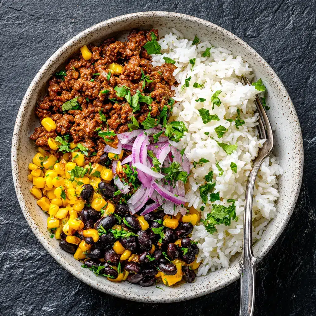 High-Protein Beef Rice Bowl (Quick & Healthy Recipe) 1 Assembling the high-protein meal prep bowls with seasoned ground beef, rice, and fresh vegetables.