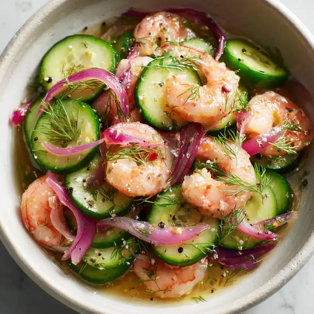 Crisp & Refreshing Cucumber Shrimp Salad 1 Plump seared pink shrimp tossed with half-moon cucumbers and a glossy dressing with black pepper flecks.