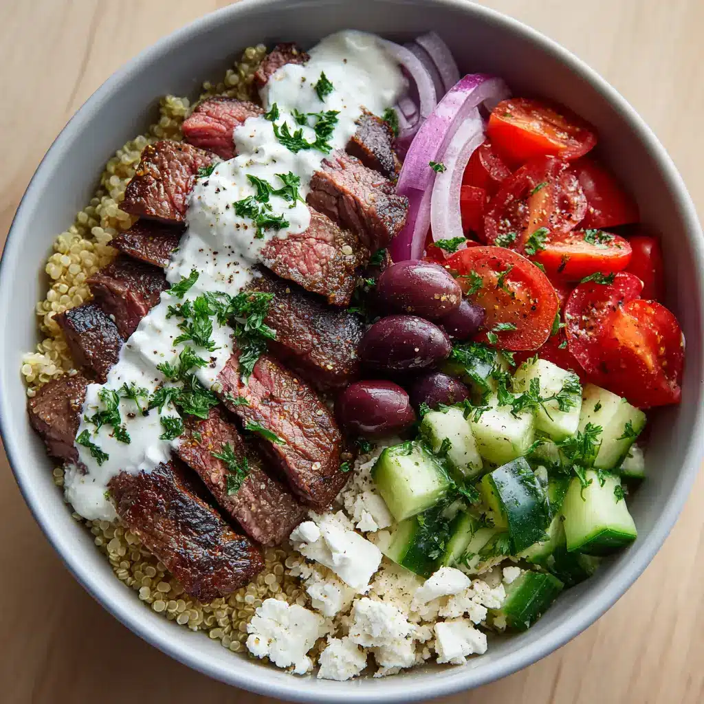 Ultimate Mediterranean Steak Bowls with Tzatziki 2 Wide shallow matte white ceramic bowl filled with cooked quinoa, perfectly seared flank steak with grill marks, and neatly arranged Mediterranean vegetables.